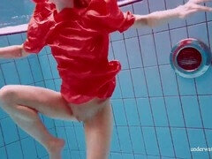 Sensual babe Avenna enjoys a naked swim in the pool