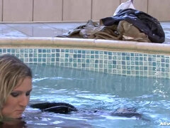 Fully dressed three lesbians in the pool