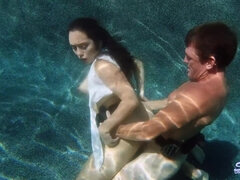 Beautiful coquette fucks under water