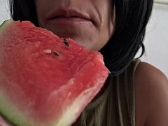 Horny French beurette with natural tits eats a juicy watermelon