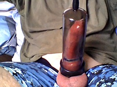 Cock with condom and cock ring in vacuum pump