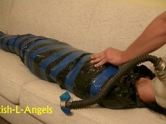 Erotic plastic mummification with a submissive Euro woman