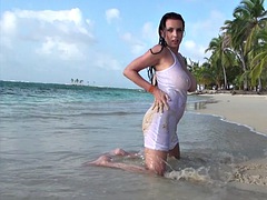 Ewa shows off one of her tits on the beach
