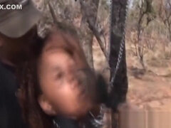 African Chick Blowing Two Stiff Cocks Outdoors