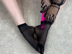 Solo foot play in black nylons with favorite toy for foot fetish lovers
