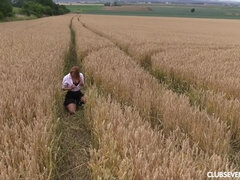Schoolgirl pleasuring herself in a wheat field