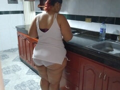 Spying on my curvy stepmom as she cleans the kitchen gets me in the mood!