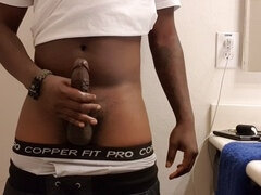 Slicked-up ebony BBC strokes itself until it explodes with messy cum