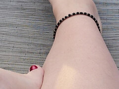 Cute Bare Feet and Legs with Red Toenail Polish and Anklet