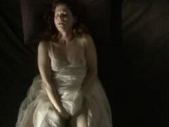 Retro mature lady pulls up her fluffy white dress and enjoys stroking pussy