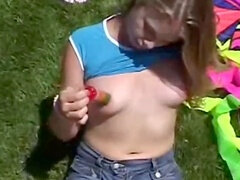 Inexperienced teenager April Blue sensually fondles her clit in the great outdoors