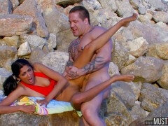 Ravishing Indian nymph with petite tits and a red summer dress gets pounded by a muscular bodybuilder on the beach