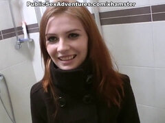 Redhead with innocent face doing perverted stuff in the publ