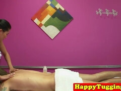Hot Asian masseuse strokes client's cock until he cums on her tits