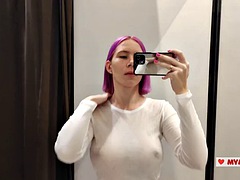 Try on transparent clothes in the fitting room. Busty blonde tries on a transparent blouse with only panties