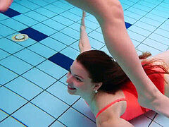 three nude ladies have fun in the water