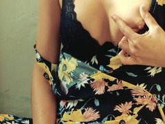 Pretty woman masturbates on camera in a dress and brings herself to a loud orgasm with her fingers.