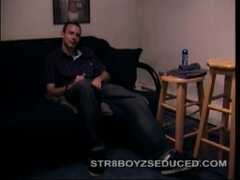 After the straight porno begins playing, Troy strips naked and begins stroking his cock, as the camera explores all the of his body.