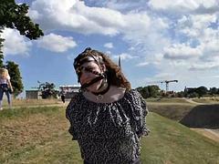 Tourist Wears Collar and Leash While Sightseeing