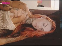 Fiery redhead undresses and tempts her online admirers