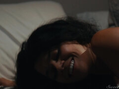 Sultry black-haired vixen seduces with fiery passion in a thrilling intimate scene
