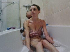 Raunchy bathtub action with big natural titties and a hung guy
