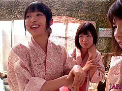 group of tiny Japanese honies sharing trouser snake in onsen