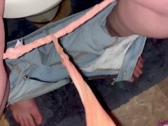 Horny MILF wife with piercings enjoys naughty pee play in bathroom