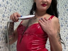 Latex dominatrix Nika showering in latex dress, watch as water droplets caress her body