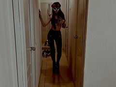 Mistress in heels in fetish leather pants