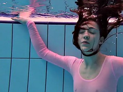 Roxalana Cech in a pink dress in the pool