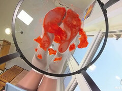 My Nylon Feet Squeezing Strawberry Juice on a Glass Table