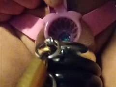 Reverse chastity belt with ring lock and blue penis plug in piss hole