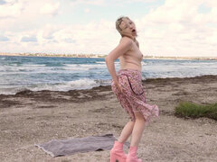 Solo masturbation on the beach by blonde Kira Viburn