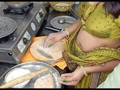 Indian aunty Kavitha Raj cooking while her husband is away, gets into some raunchy cowgirl action with her big natural tits