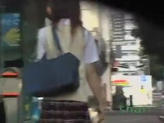 Jolly Japanese babes filmed on a in public