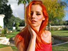 Sexy outdoor striptease from a dazzling redhead