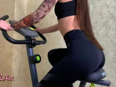 DOUBLE ORGASM ON AN EXERCISE BIKE. FUCKS A TOY AND CUMS.
