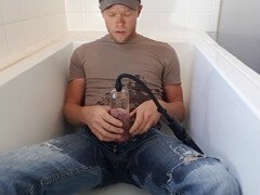 Muscle hunk has some fun with a pipe pump and waterworks