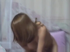 Asian teen sucks on dildo