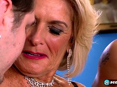 Watch hot blonde milf Georgette Parks get down and dirty with two studs for the first time on camera!