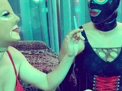 Sissy in latex receives an intense smoky blowjob lesson from domineering mistress