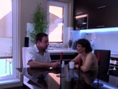 Brunette mom blows off and bangs in the kitchen