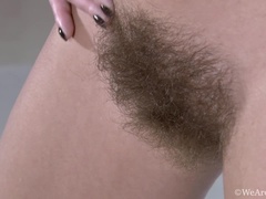 Dominique strips naked to show us her hairy body