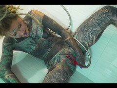 Tattooed babe Anuskatzz gets her tight ass pounded in the bathroom