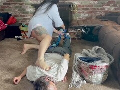 Mistress G ties up her sub boy in a hogtie using a scarf