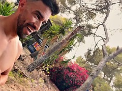 Fitness man walks completely naked in an abandoned building