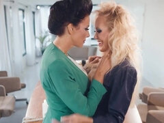 Horny MILFs scissor each other's cunts in a conference room