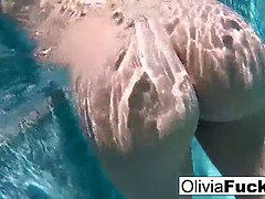 Horny Olivia Austin plays with her pussy underwater