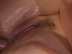 Oiled-up brunette babe gets a hardcore anal drilling